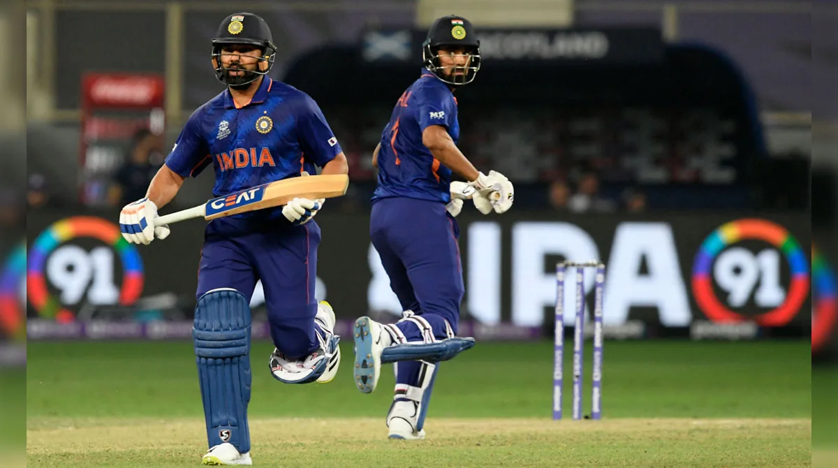 Two India batters running between the wickets during a cricket match